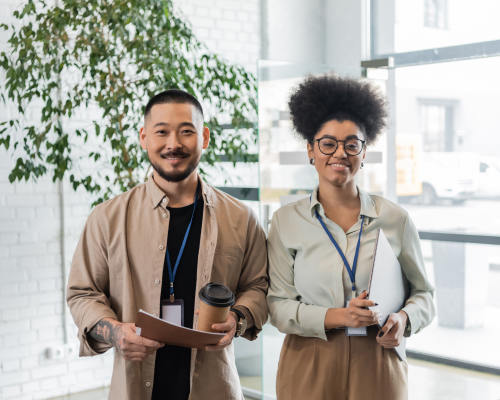 Two team members smiling at work